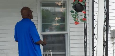 Kenneth Hemphill inspects the work on his home in Hannibal, Missouri.