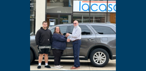 A family buys a new car through a lacasa loan program.