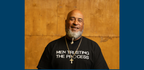 Felix Colon, wearing a black t-shirt and a cross. 